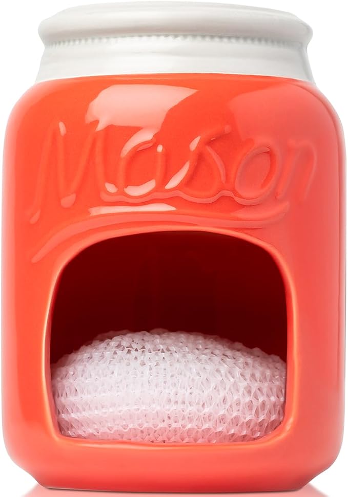 Comfify Coral Mason Jar Ceramic Sponge Holder – Farmhouse Sink Caddy | Coral; mason jar ceramic; 5"H x 3.75" diameter; includes nylon scrubby; embossed ‘MASON’; decorative lid; farmhouse