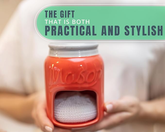 Comfify Coral Mason Jar Ceramic Sponge Holder – Farmhouse Sink Caddy | Coral; mason jar ceramic; 5"H x 3.75" diameter; includes nylon scrubby; embossed ‘MASON’; decorative lid; farmhouse